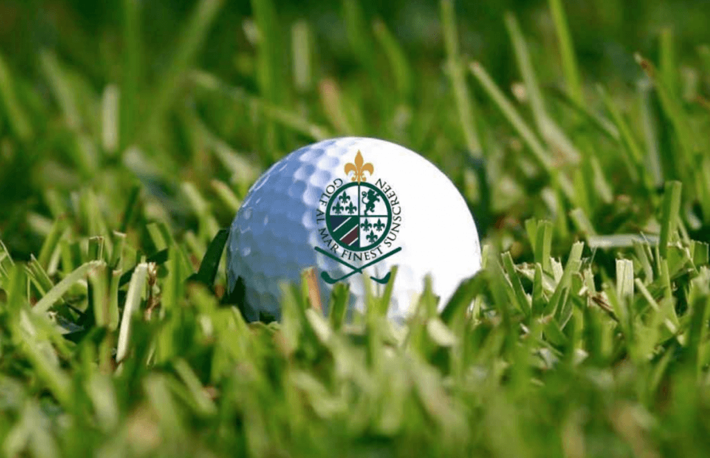 GOLF AL MAR branded golf ball on grass